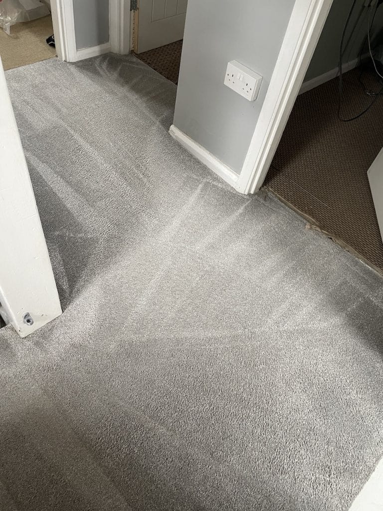 Grey hallway carpet after professional cleaning in Northampton