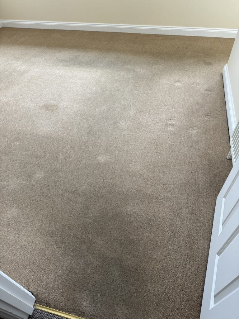 Empty HMO bedroom carpet before professional cleaning in Rothwell